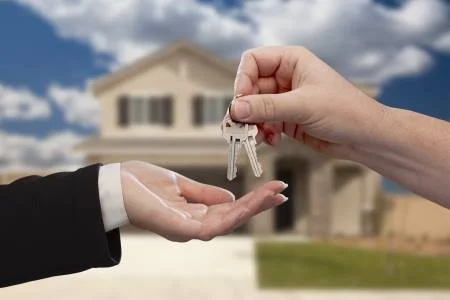 Homeowner receiving keys after successful residential mold remediation in Charlotte, NC.
