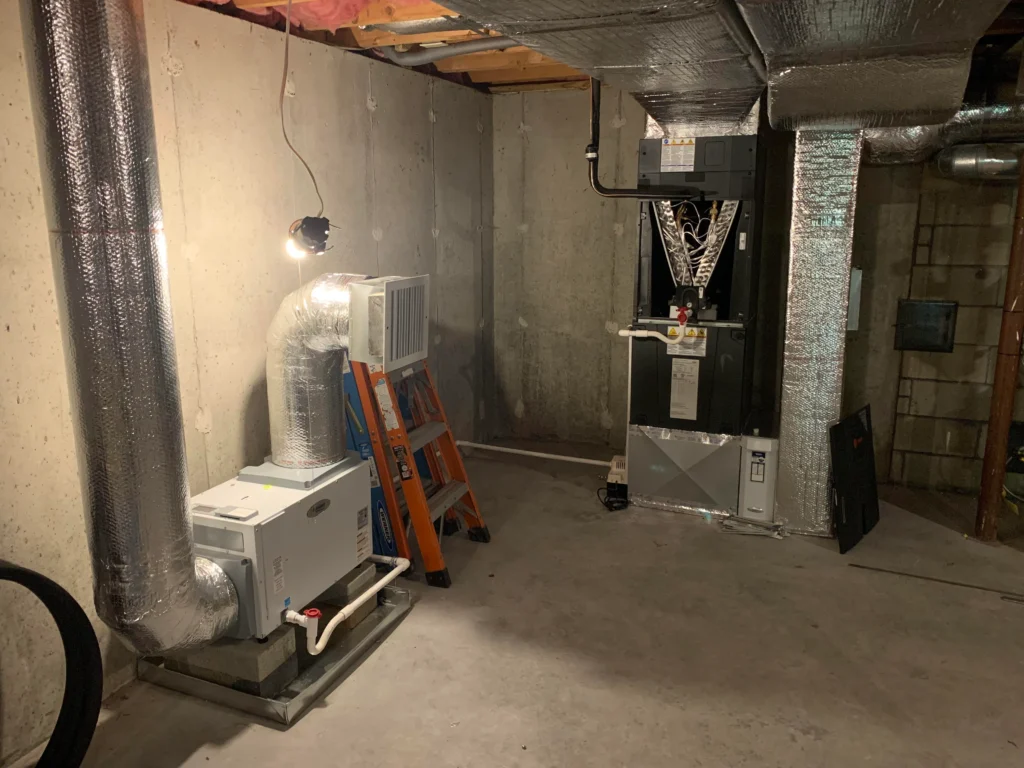 Whole-basement dehumidification system installed in a Charlotte home to maintain optimal humidity and prevent mold regrowth.