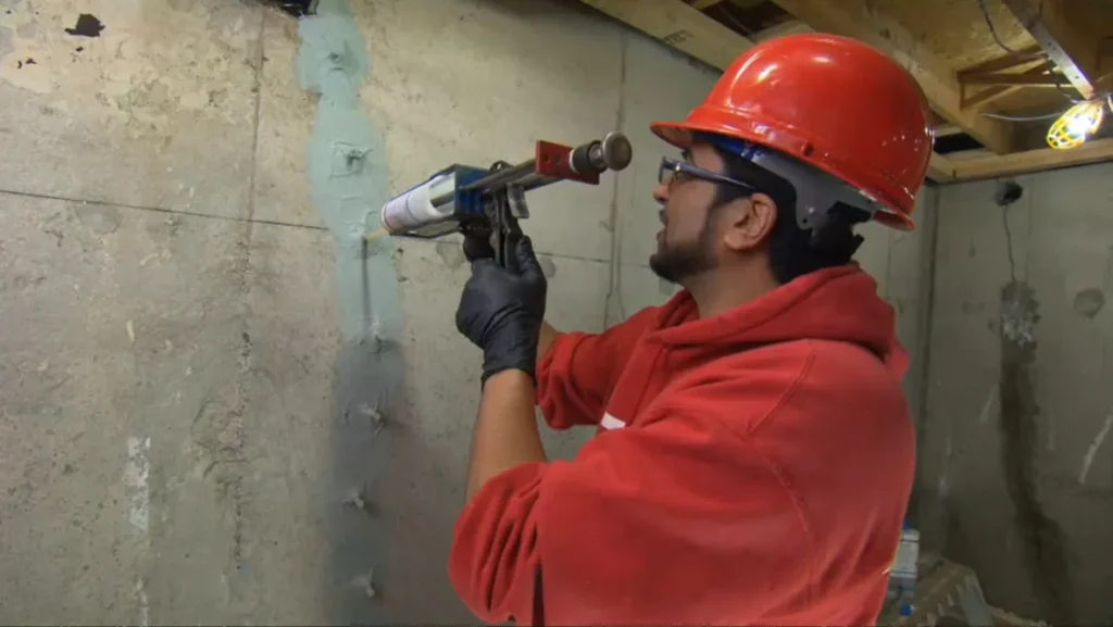 Professional foundation crack injection and sealing in a Charlotte basement to stop water leaks and prevent mold growth.